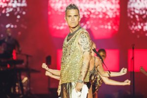 Robbie Williams cries at his concert when remembering his addictions
