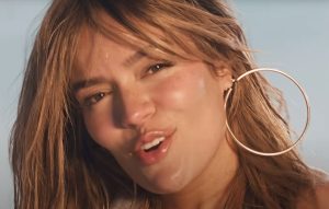 Karol G celebrates the feminine look in the fun 'Latin Foreva'
