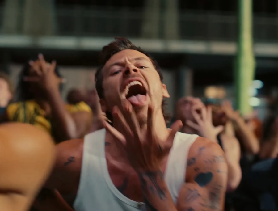 Harry Styles rescues Travolta's mini shorts in 'Dance No More'