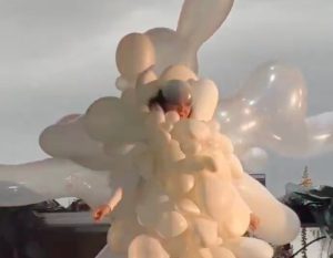 Björk outdoes herself and appears dressed in balloons for the eclipse